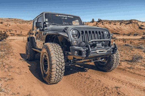 Off-road Jeep suv equipped with a winch, showing a 4x4 recovery vehicle ready for synthetic winch rope and recovery gear applications